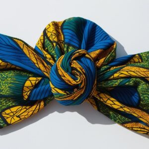 Folded African headwrap in bold Ankara fabric, isolated on white background, no shadows, styled for online store display”